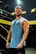 Blue Cut off vest on a bodybuilder